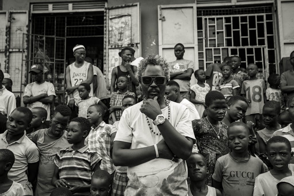 Monochrome street scene in Kampala, capturing diverse community life.