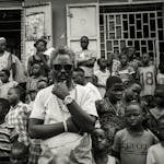 Monochrome street scene in Kampala, capturing diverse community life.